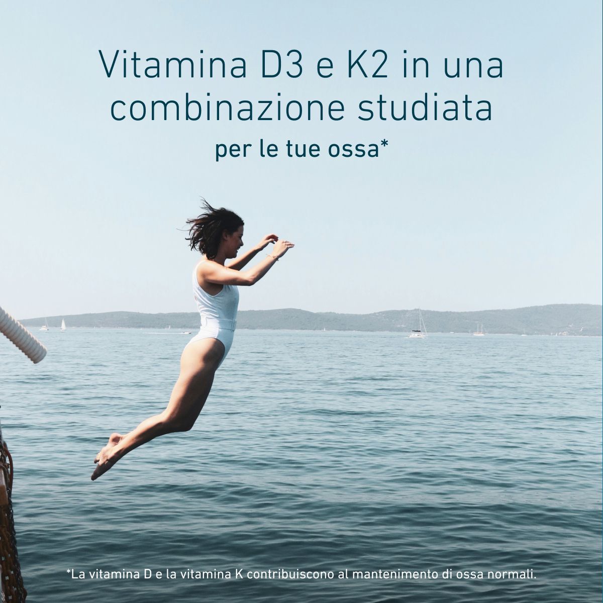 Donna che si tuffa in mare per rappresentare la salute delle ossa con BIOGENA Vitamin D3 & K2, combinazione di vitamine D3 e K2 studiata per il mantenimento di ossa normali.