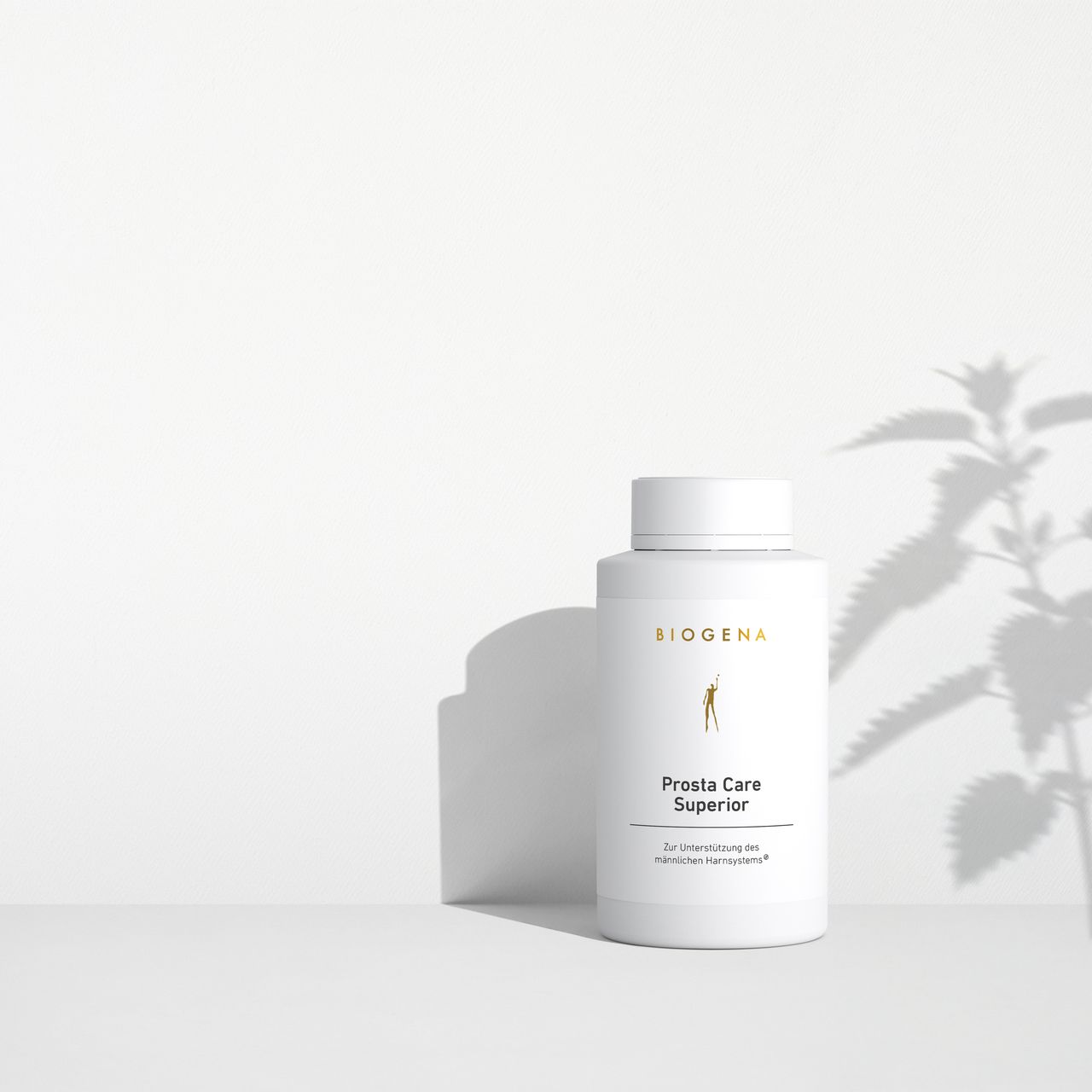 BIOGENA Prosta Care Superior against a minimalist white background, with soft shadows cast by a plant.