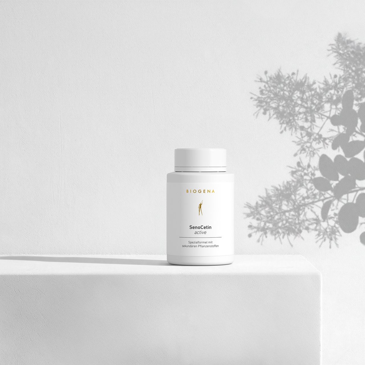 BIOGENA SenoCetin active in a white bottle placed on a surface, with plant shadows in the background. The label reads "Special formula with secondary plant compounds."