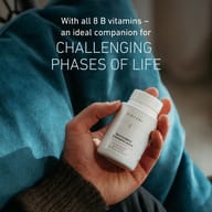 Hand holding Biogena Neurosagena® B-Komplex Active bottle, text highlighting all 8 B vitamins as an ideal companion for challenging life phases.