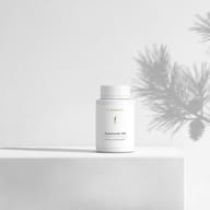 BIOGENA PycnoCardio® Q10 against a minimalist white background, with soft shadows cast by a plant.