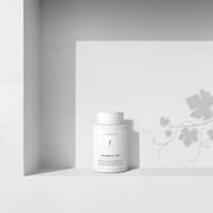 BIOGENA Pycnogenol® 100 supplement in a white bottle on a minimalist background with light and shadow. Product contains patented French maritime pine bark extract to support microcirculation.