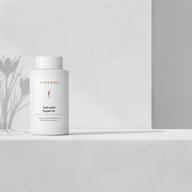 BIOGENA Safrodia® Superior supplement in a white bottle on a minimalist background with light and plant shadows. Emotional Balance Selection with rhodiola rosea and saffron to support emotional balance.