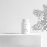 BIOGENA SenoCetin active in a white bottle placed on a surface, with plant shadows in the background. The label reads "Special formula with secondary plant compounds."