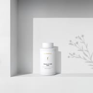 BIOGENA Vitamin D 2000 DUO in a white bottle placed on a shelf, with plant shadows in the background. The label reads "Vitamin D and flaxseed oil."