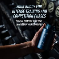 Hand holding BIOGENA SPORTS ZMB6 in a fitness environment. Special complex with zinc, magnesium, and vitamin B6 designed to support athletes during intense training and competition phases.
