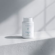 Biogena DreiSalz Zink 9 mg plastic bottle, white bottle on concrete block, grey background, shadow