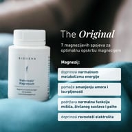 Opakowanie BIOGENA Siebensalz Magnesium na niebieskiej tkaninie, z informacjami o 7 związkach magnezu, metabolizmie energetycznym, zmęczeniu, mięśniach, układzie nerwowym i równowadze elektrolitowej.