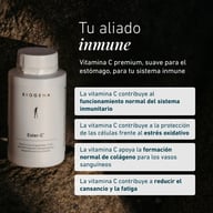 Butelka Ester-C® Biogena na kamiennej powierzchni, z tekstem o witaminie C dla funkcji odporności, ochrony przed stresem oksydacyjnym, tworzenia kolagenu i zmniejszenia zmęczenia.
