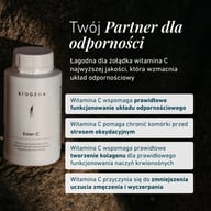 Butelka Ester-C® Biogena na kamiennej powierzchni, z tekstem o witaminie C dla funkcji odporności, ochrony przed stresem oksydacyjnym, tworzenia kolagenu i zmniejszenia zmęczenia.