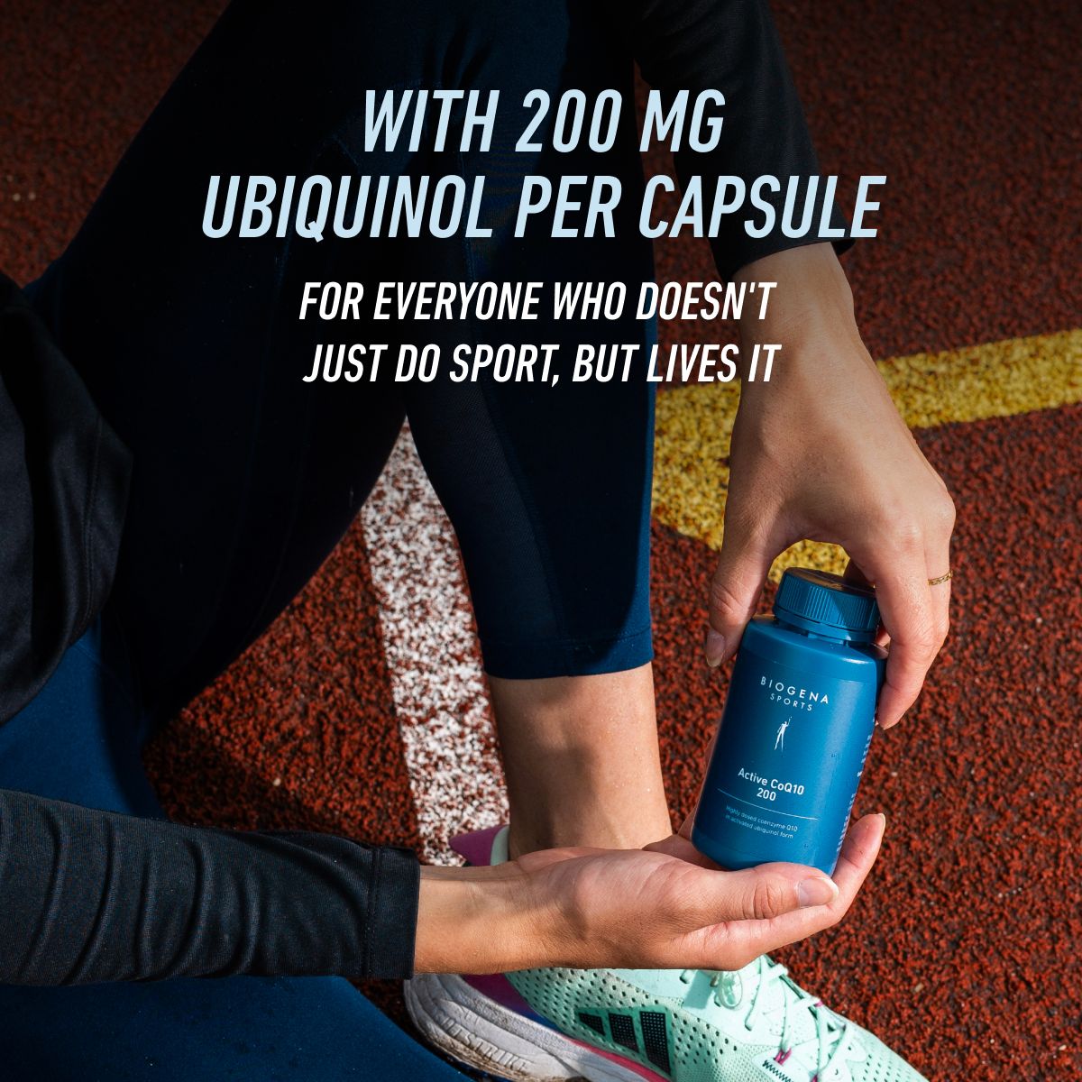 Athlete holding BIOGENA SPORTS Active CoQ10 200 on a running track. High-dose supplement with 200 mg ubiquinol per capsule for people who live and breathe sport.