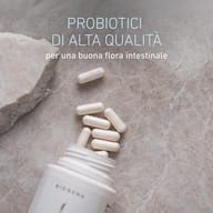 Capsule di BIOGENA Omni Lactis® 20 accanto al flacone aperto, con batteri lattici e bifidobatteri premium per il benessere intestinale.