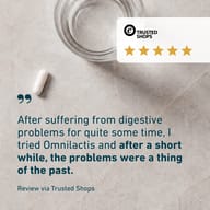 BIOGENA Omni Lactis® 20 capsule beside a five-star Trusted Shops review describing a positive experience with the product.