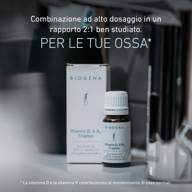 Confezione e flacone delle gocce BIOGENA Vitamina D₃ & K₂ su un piano d'appoggio. Il testo evidenzia la combinazione ad alto dosaggio in rapporto 2:1 e il contributo delle vitamine D e K al mantenimento di ossa normali.